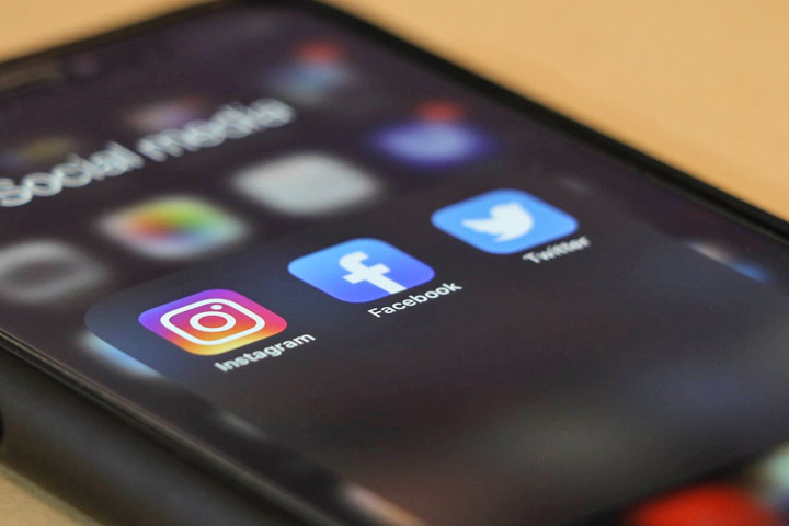 iphone with social media icons